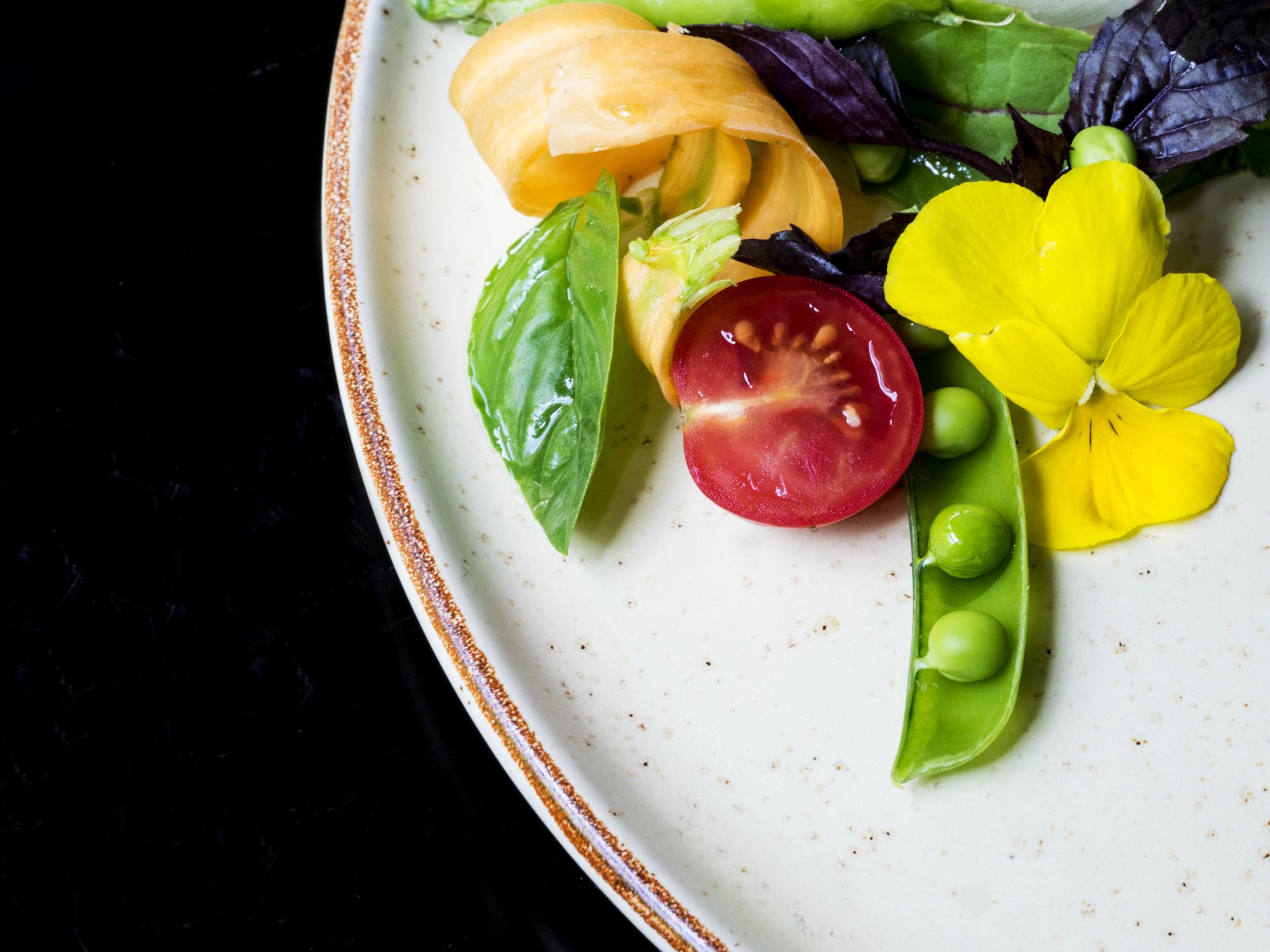 Close-up of plated gourmet meal kit with vibrant vegetables